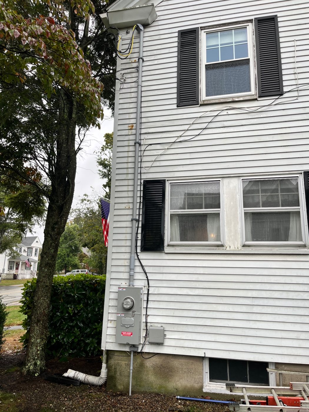 New exterior meter, service mast and disconnect on a colonial home